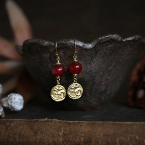 amber + golden om earrings