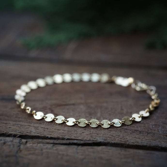 golden disk bracelet
