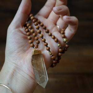 sandalwood + rutilated quartz mala