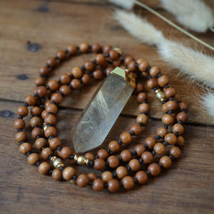 sandalwood + rutilated quartz mala