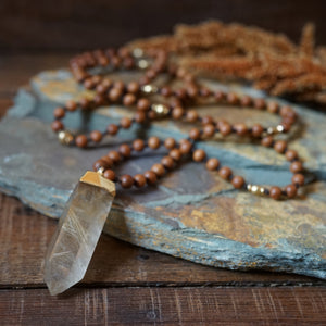 sandalwood + rutilated quartz mala