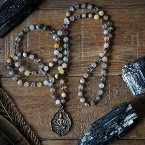 multi rutile quartz + buddha mala