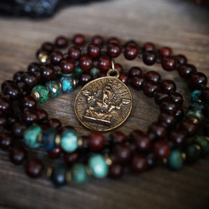 ganesh on an azurite + rosewood mala